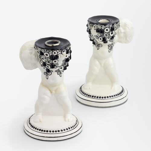 An Assembled Pair of Putti Candle Holders by Michael Powolny