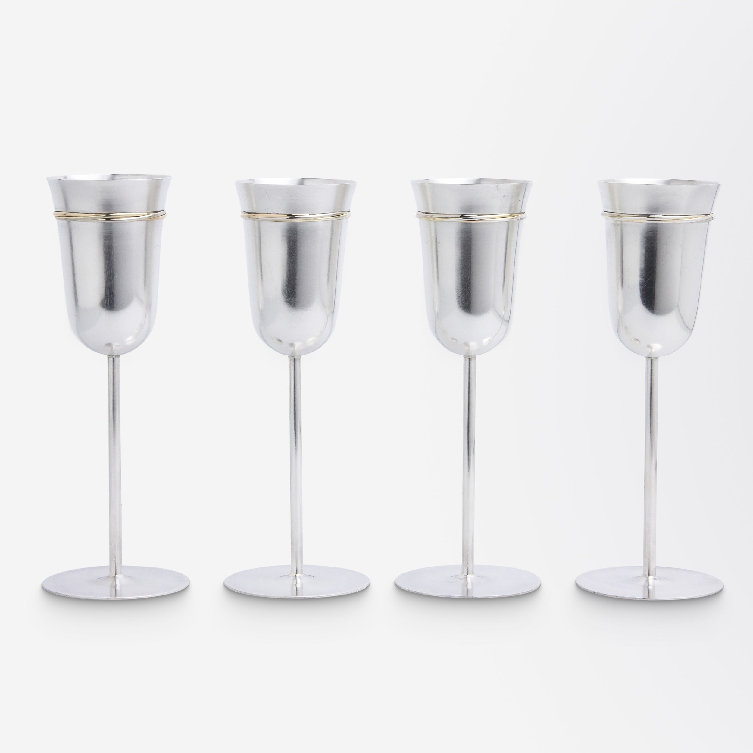 Set of Four Cartier 'Trinity' Sterling Silver Champagne Flutes